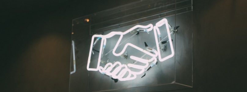 neon-handshake-twitter